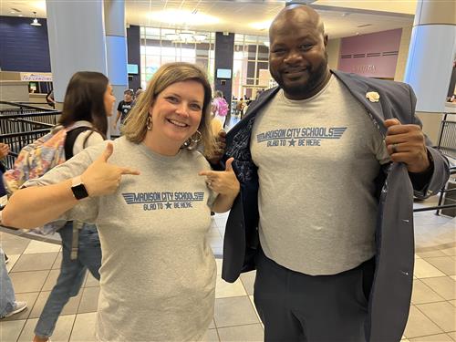 James Clemens admins showing off their Glad to Be Here shirts